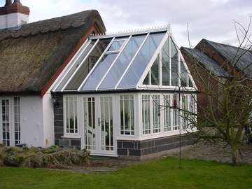 Design and Biuld project : Corwen Nr Wrexham : Evolution storm windows in white whitewood , Astragal bar to Architects design . Roof K2 double glazed with Celsius one 